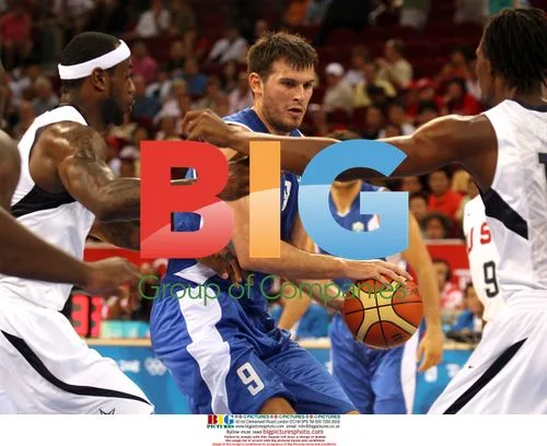 Greece's Fotsis Guarded by USA's James and Bosh