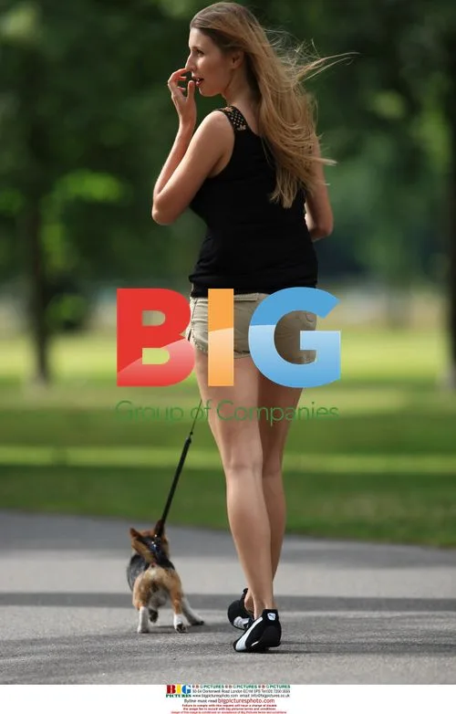Claudia Ciesla Takes Dog for Walk in Hyde Park