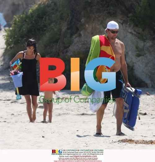Pregnant Angie Harmon on the Beach