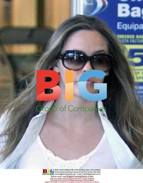 Alicia Silverstone Departs LAX
