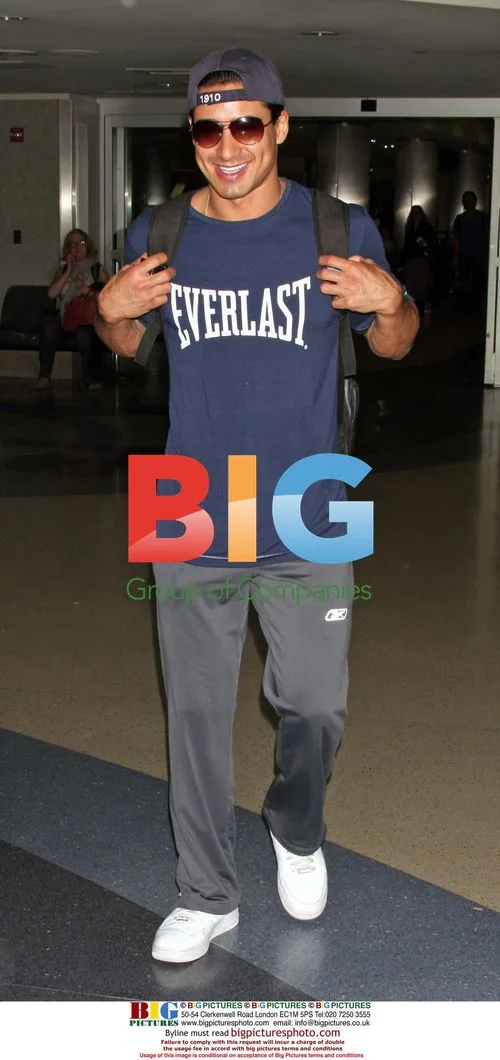 Cheerful Mario Lopez Arrives at LAX