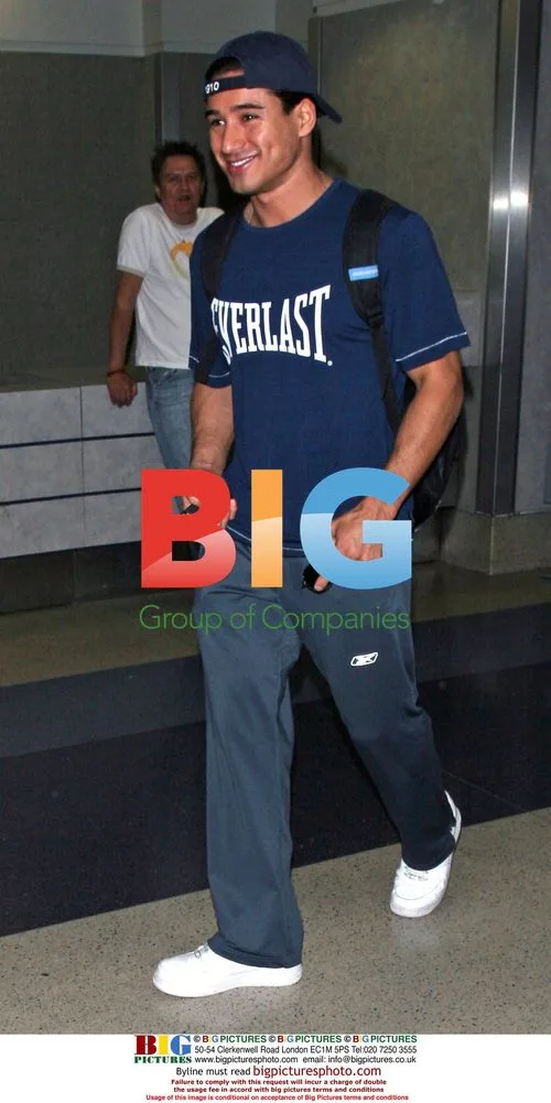 Cheerful Mario Lopez Arrives at LAX