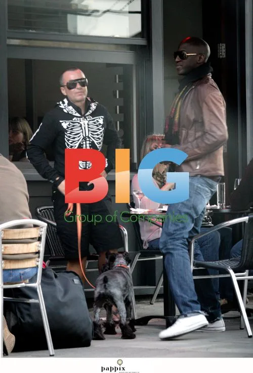 Designer Julian MacDonald with boyfriend and dog