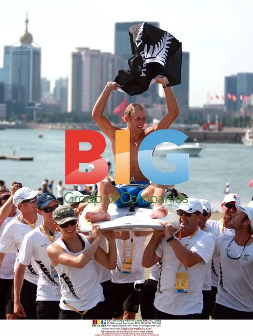 Tom Ashley celebrates winning sailing gold