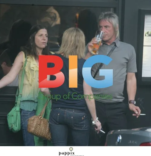 Paul Weller Takes Cigarette Break in London Pub