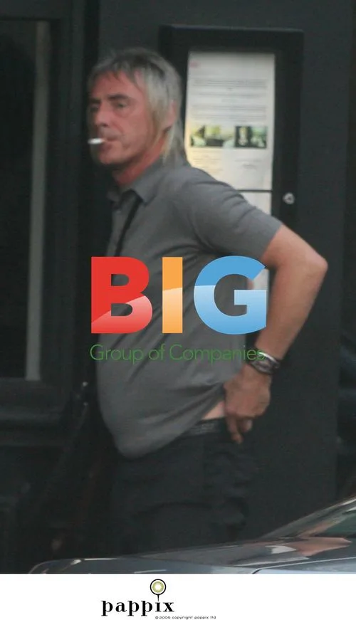 Paul Weller Takes Cigarette Break in London Pub