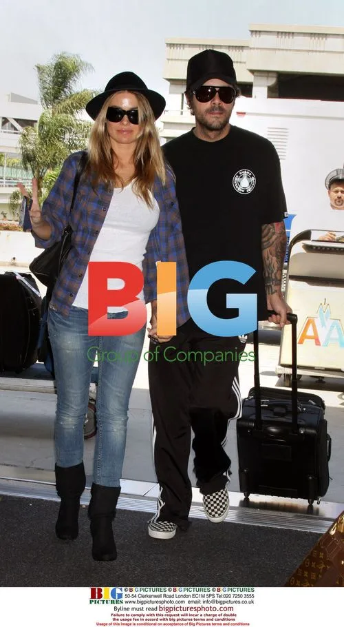 Carmen Electra and fiancee Rob Patterson depart LAX