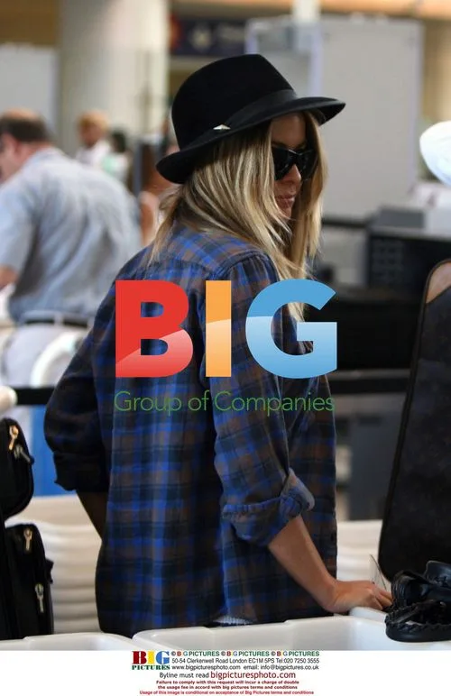Carmen Electra and Rob Patterson depart LAX