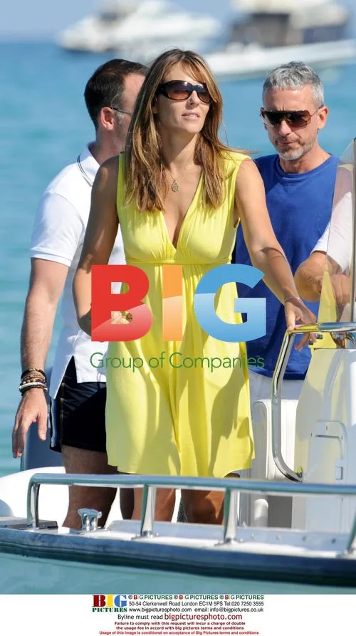 Liz Hurley with Arun Nayar and Hugh Grant in Saint-Tropez