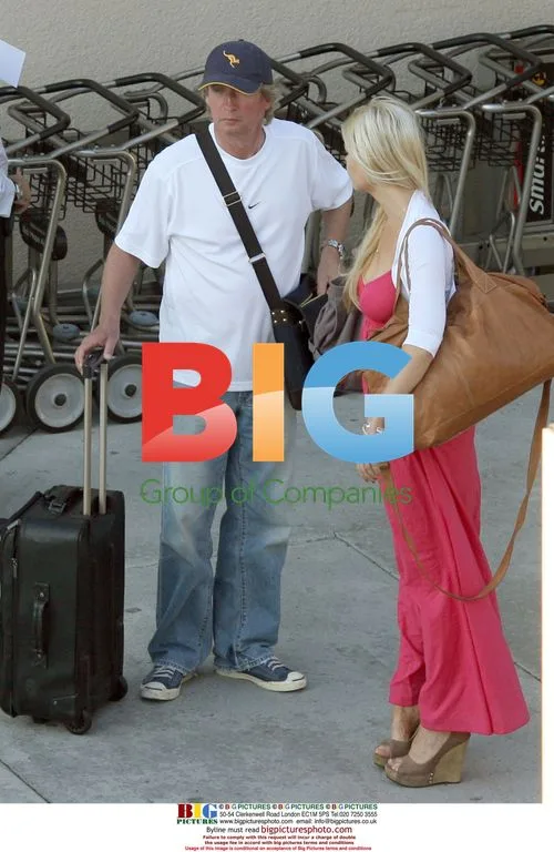Nigel Lythgoe and Sophie Monk Arrive in Burbank