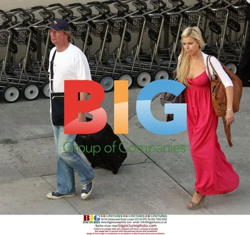 Nigel Lythgoe and Sophie Monk arrive at Burbank Airport