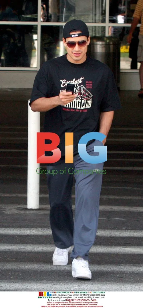 Mario Lopez arrives at LAX with luggage