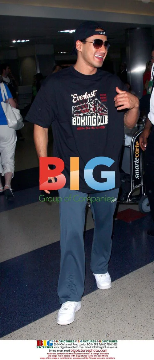 Mario Lopez arrives at LAX with luggage