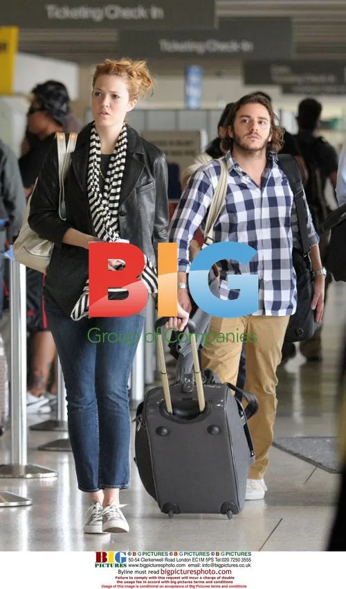 Mandy Moore departs from LAX with mystery man