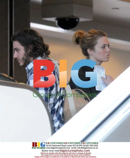Mandy Moore and mystery man depart LAX