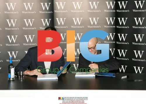 Michael Stipe and David Belisle sign R.E.M. photo book