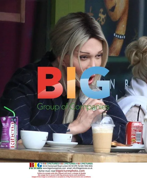 Pete Burns and boyfriend out in London