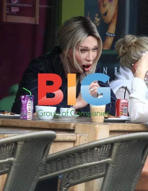 Pete Burns and boyfriend out in London