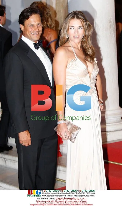 ELIZABETH HURLEY and ARUN NAYAR at The Last Emperor premiere
