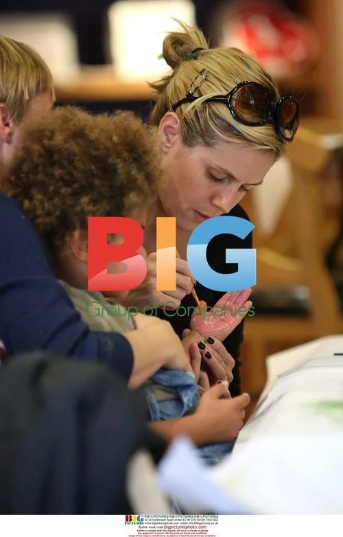 Heidi Klum and family at Colour Me Mine shop