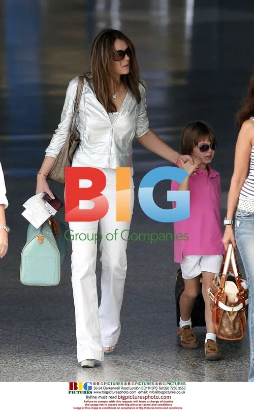 Liz Hurley and son Damian at airport