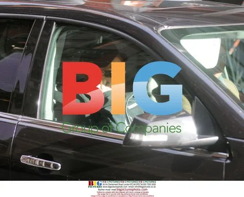 Jon Bon Jovi chats on cell phone in car