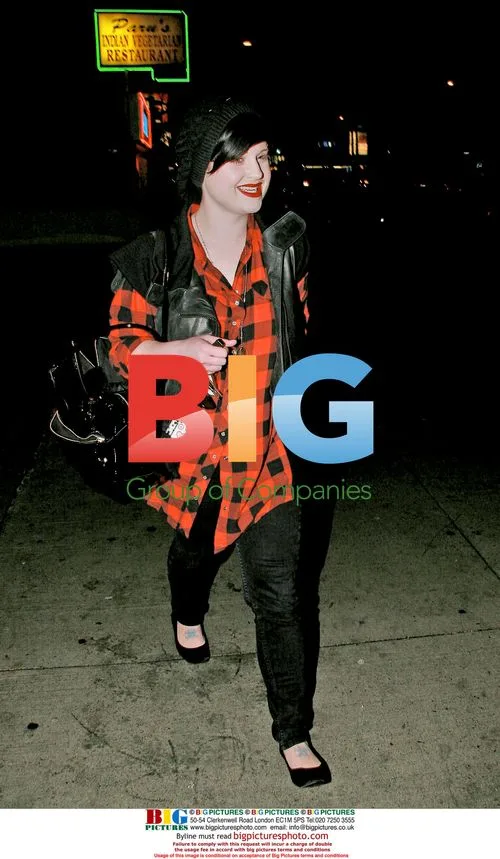 Lindsay Lohan hides behind balloons