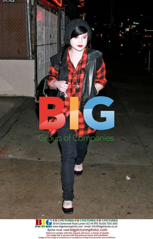 Lindsay Lohan hides behind balloons