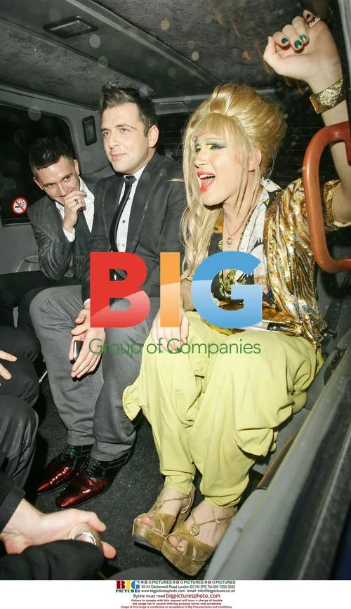 Jodie Harsh and Mark from Westlife leaving hotel
