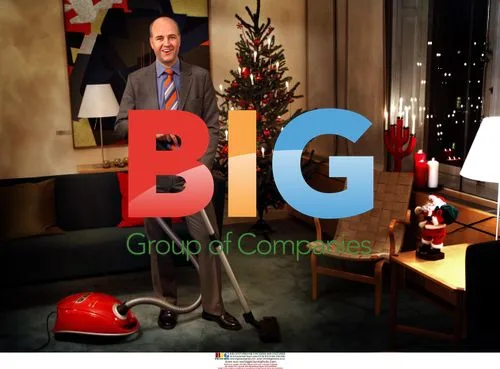 Swedish PM Reinfeldt poses with vacuum cleaner