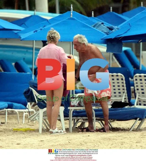 Michael Winner relaxes on Sandy Lane beach