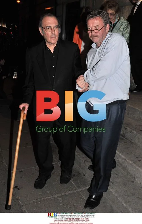 Harold Pinter and Michael Colgan leaving The Gate Theatre
