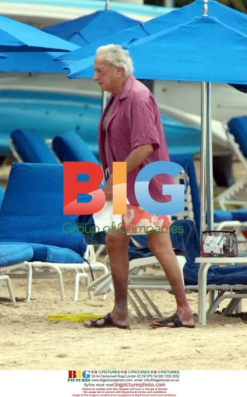 Director Michael Winner on Sandy Lane beach