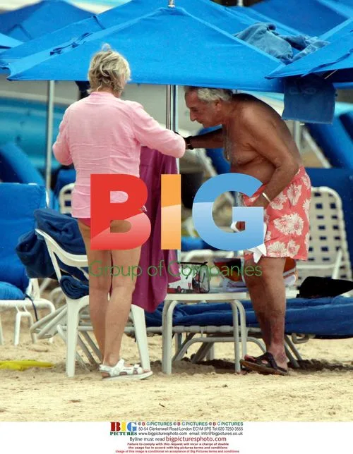 Michael Winner relaxes on Sandy Lane beach