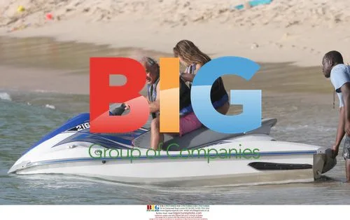 Phil Green rides Jet ski with daughter