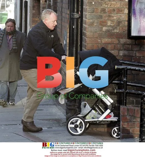 Les Dennis with baby at Liverpool theatre