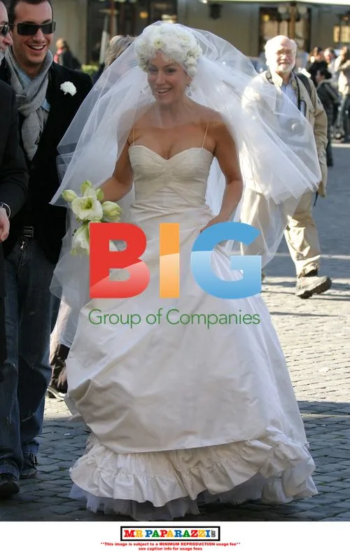 Nancy Dell'Olio Poses in Wedding Dresses