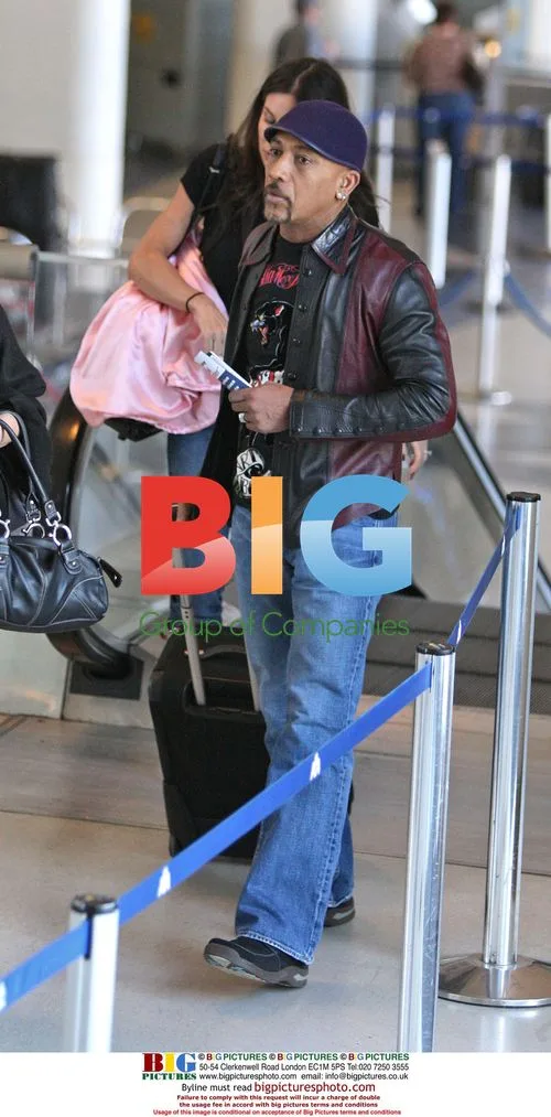 Montel Williams and wife Tara Fowler depart LAX