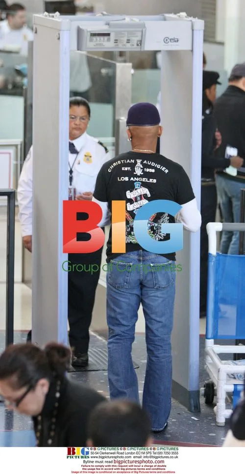 Montel Williams Departs LAX with Wife