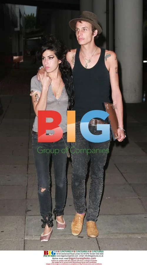 Amy Winehouse and Blake Fielder-Civil Arrive at Gatwick