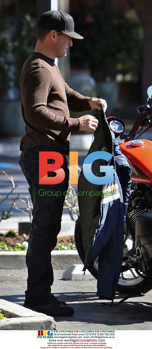 George Eads with girlfriend on motorcycle