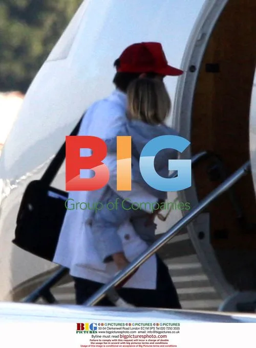 Jennifer Aniston and mystery man board private jet