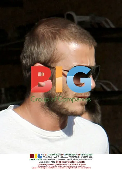 David Beckham shops for sunglasses with son Brooklyn