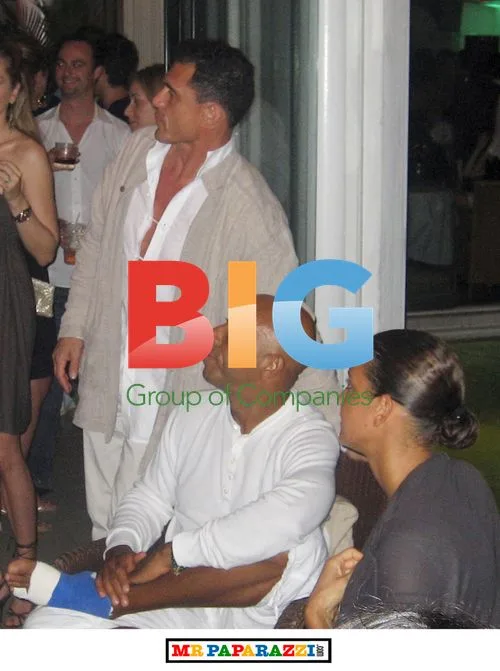 Russell Simmons with girlfriend at party in St. Barth