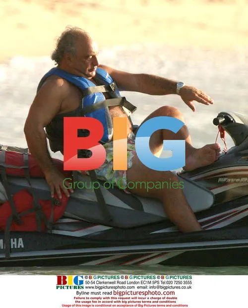 Simon Cowell and Philip Green on jet ski in Barbados