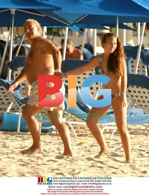 Simon Cowell and Philip Green on jet ski in Barbados