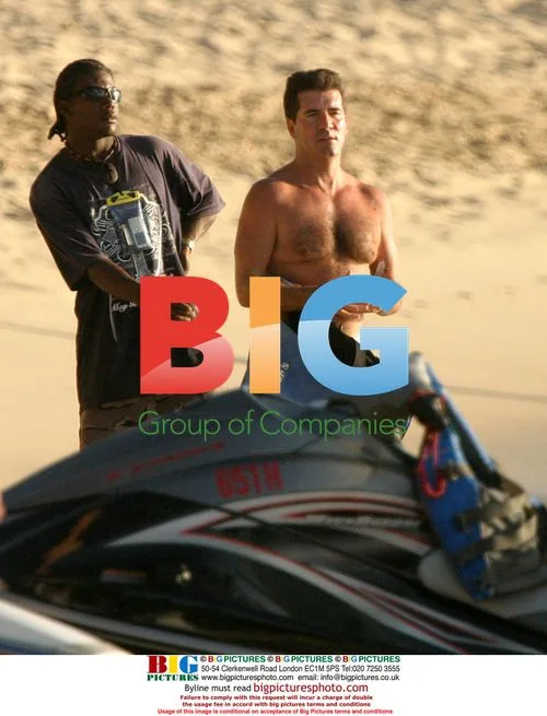 Simon Cowell and Philip Green on jet ski in Barbados