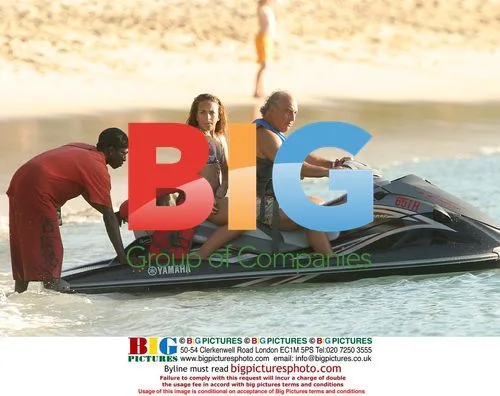Simon Cowell on jet ski with Philip Green and daughter