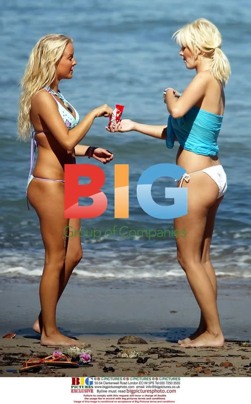 Models Anna Taverner and Michelle Marsh relax in France
