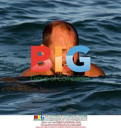 Owen Wilson and Woody Harrelson swim in Maui